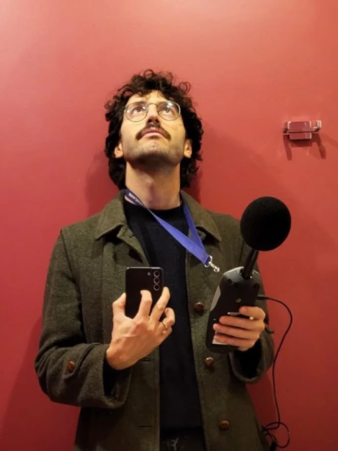 Lorenzo taking a sound level measurement